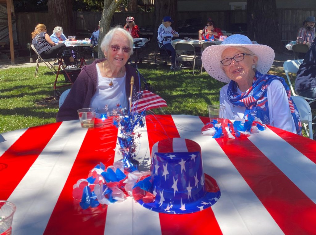2-lady-friends-at-july-4th-picnic-table