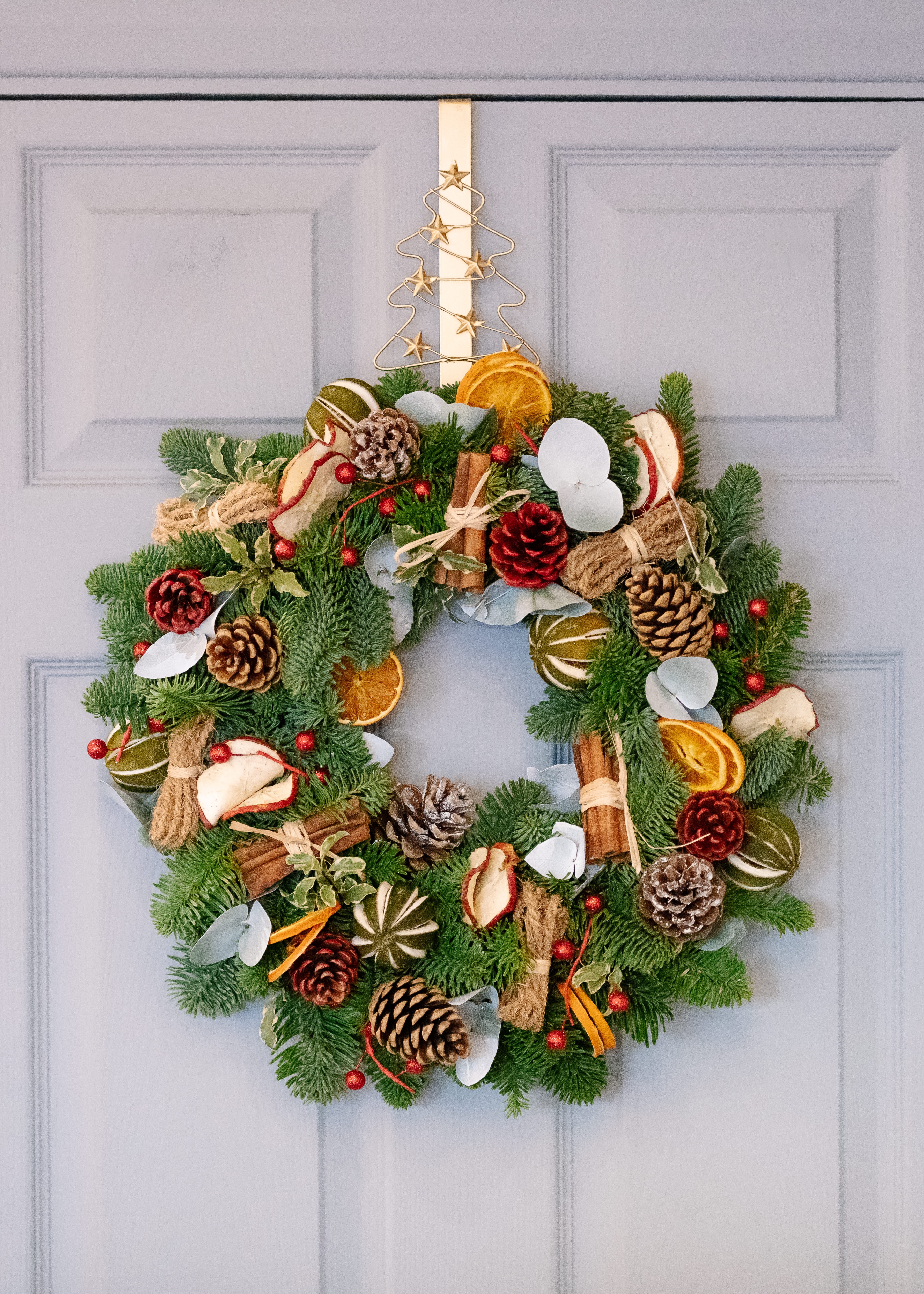 holiday wreath by corina andrisca on unsplash